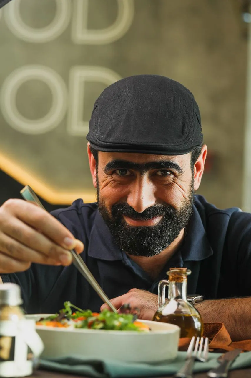 Chef Rami plating a dish