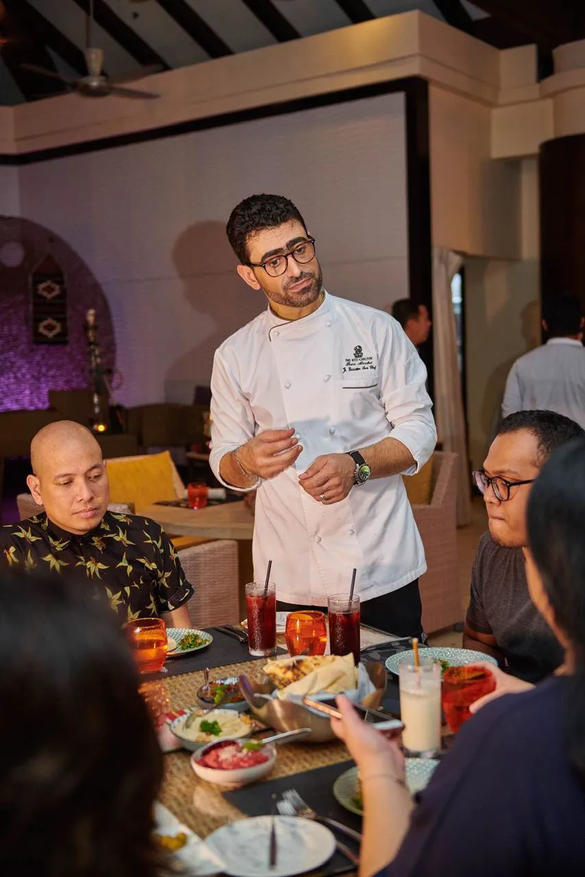 Chef Rami hosting guests at The Ritz-Carlton Dubai